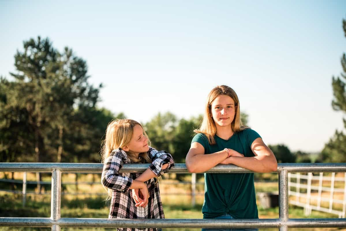 Two sisters on a fence-1